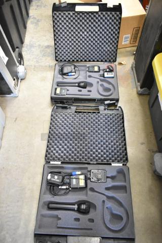 Two Sennheiser SK100 bodypack transmitters in foam-lined carry cases, excellent condition, includes microphones and accessories.