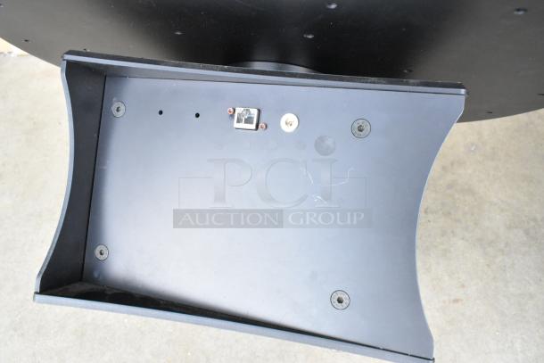 SKB unit with a black finish, featuring ports and mounting points. Exhibits minor surface wear, ideal for audio equipment setup.