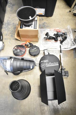Lot of photography equipment including Westcott snoot, 20" reflector, M-Q mount, Impact collapsible holder, and 55" umbrella.