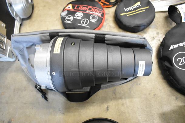 Lot of photography items including Westcott Snoot, 20" Reflector, Impact holder, 55" umbrella reflector, shown in a poly bin.