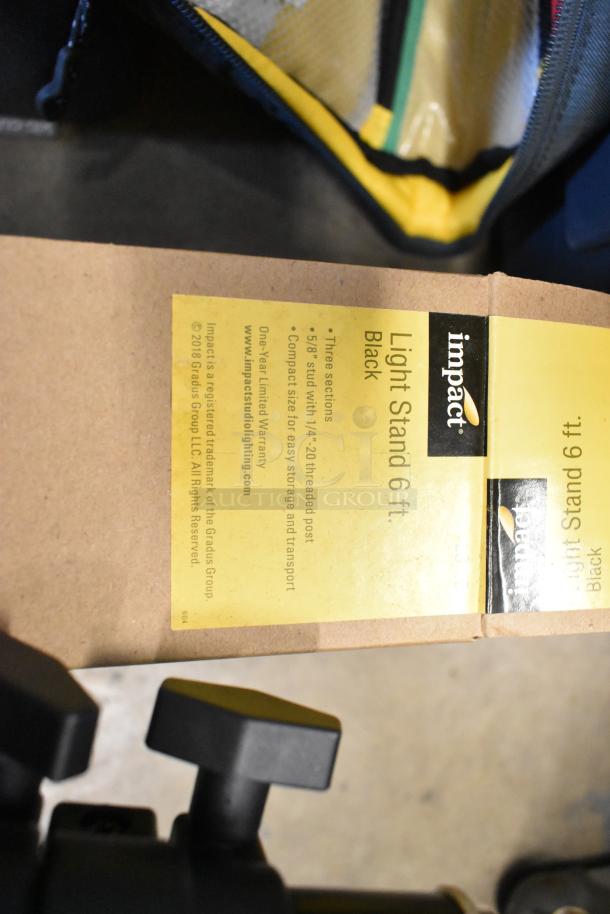 Impact 6 ft light stand label, black, with product description. Items include lightbulb and fabric in poly bin.