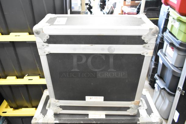 Cadence hard case in sturdy condition with metal reinforcements and corner protectors; visible label reads "Cadence."