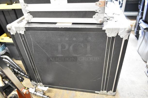 Cadence hard case with reinforced metal corners, black exterior, and visible scuff marks, indicating used condition.