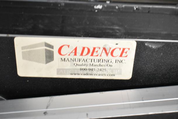 Cadence Hard Case with manufacturer's label indicating "Cadence Manufacturing, Inc." and website. Appears in good condition.