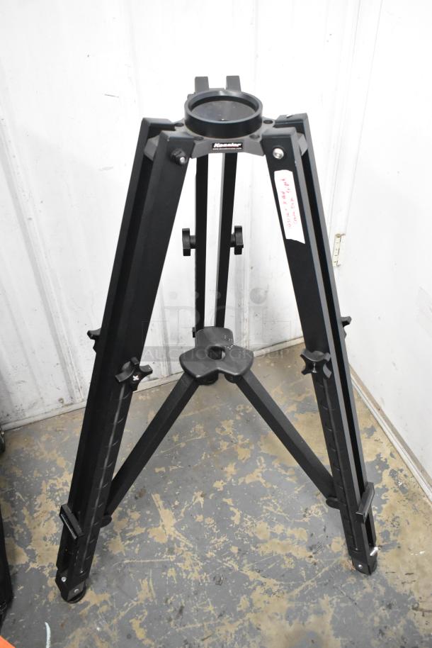 Kessler Tripod with sturdy metal legs in good condition, featuring locking mechanisms and adjustable height.