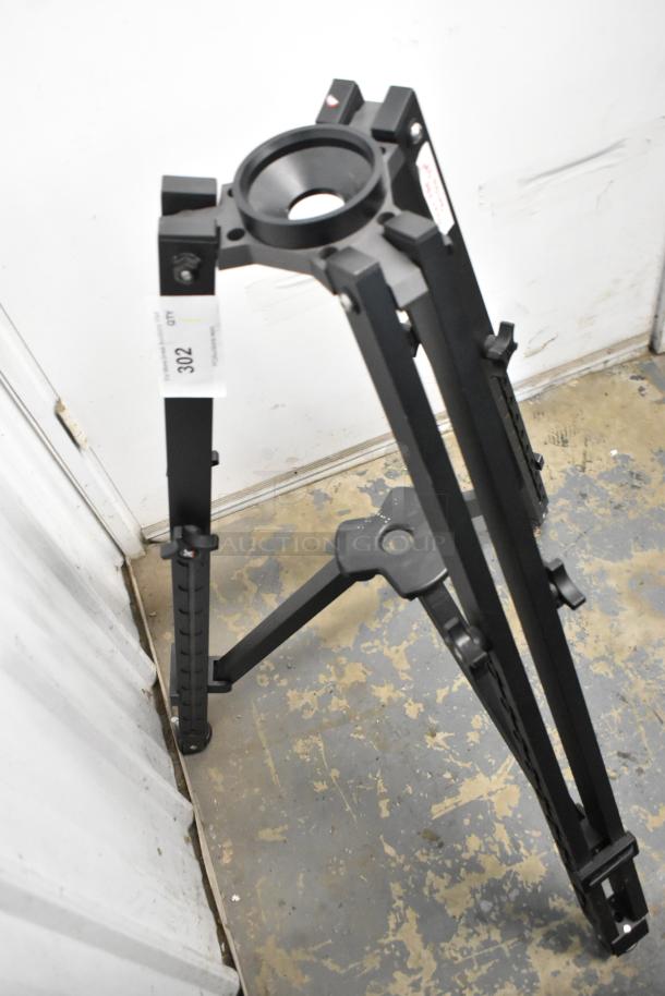 Kessler tripod in good condition, black metal frame, adjustable legs. Auction tag number 302 attached.