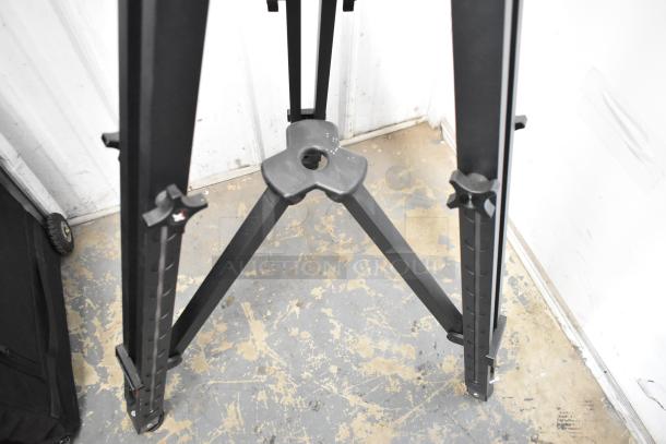 Kessler Tripod with adjustable legs, sturdy build, black finish, good condition, showing leg adjustment knobs.