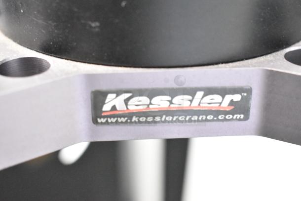 Kessler Tripod with black metal construction, visible logo and website URL indicating brand authenticity.