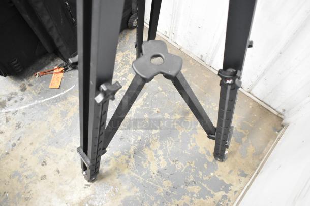 Kessler tripod with adjustable legs, heavy-duty build, and stable base in good condition.