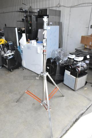 Matthews Studio Equipment tripod, durable metal construction, adjustable height, sturdy legs, ideal for professional use.
