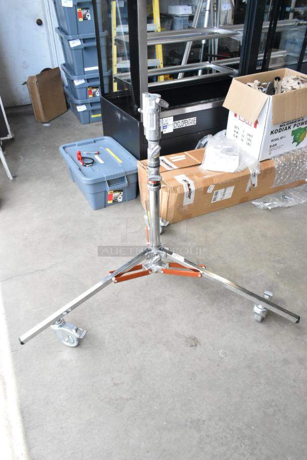 Matthews Studio Equipment tripod on casters, sturdy metal, includes soft case, excellent condition, ideal for professional use.