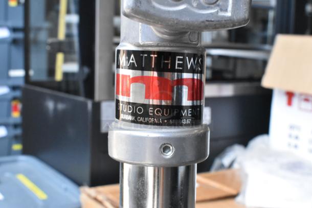 Matthews Studio Equipment tripod on casters, metal construction, visible logo label, in soft case, excellent condition.
