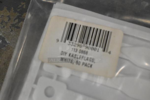 Lot includes Kableflags pack labeled "DIY Kableflags, White, 50 Pack", wires, and Vault equipment case; assorted condition.