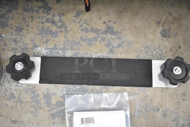 Lot of various items including Kableflags, wires, and a vault equipment case on a mottled floor. Visible barcode on plastic bag.