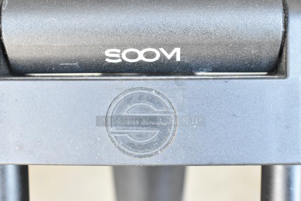 Soom tripod with visible Sachtler Germany logo, in a protective soft case.