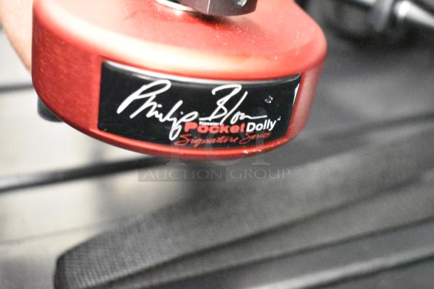 Philip Bloom Pocket Dolly in hard case, red finish, with signature series label. Excellent condition, ideal for smooth camera slides.
