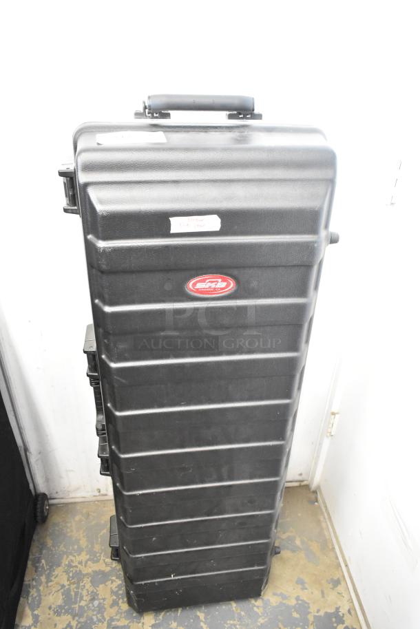Philip Bloom Pocket Dolly in Hard Case, sturdy black case with red label, protective storage for film equipment.