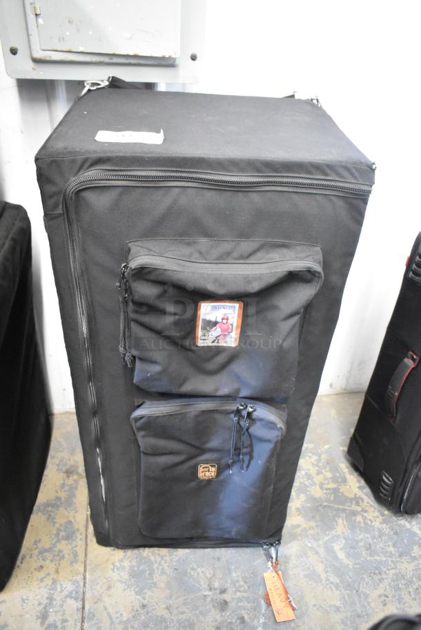 Black Porta Brace case with dual zippered pockets, durable fabric, and attached identification tags. Good condition.