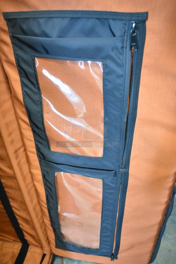 Porta Brace case with clear plastic pockets and black zippers on orange fabric. Sturdy and durable construction.