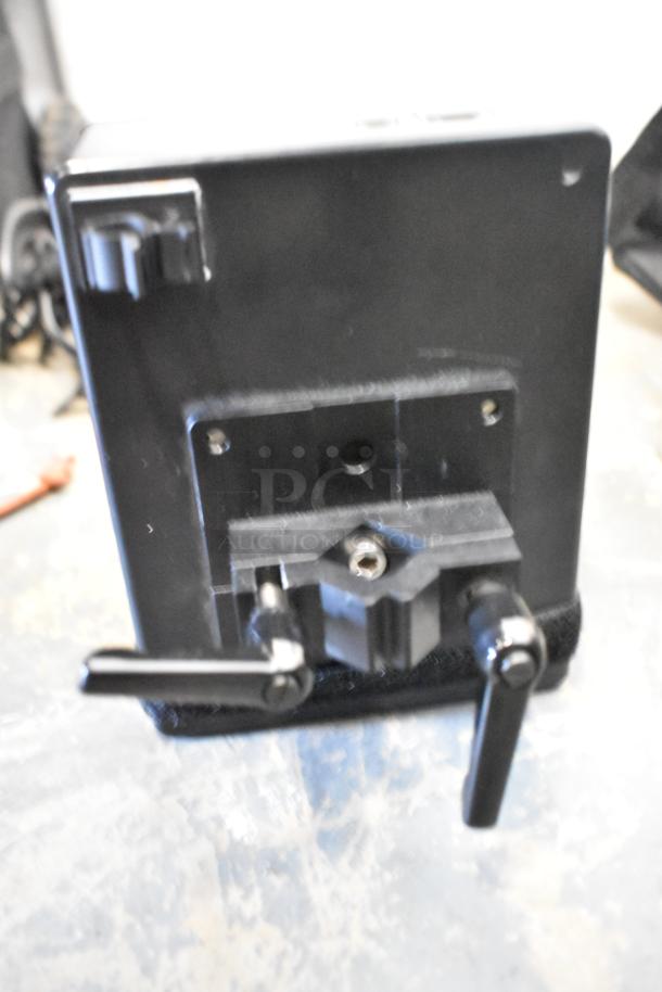 Kessler filmmaking unit with Power Sonic PS-1270F1 rechargeable battery in black case; used condition, visible mounting hardware.