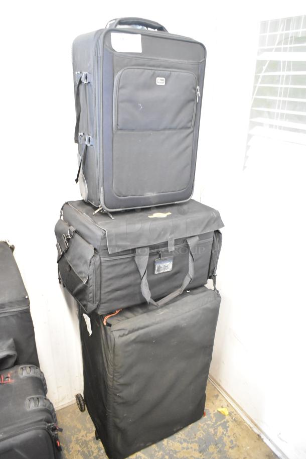 Three black bags stacked, including Lowepro, Tenba, and Porta Brace. Dimensions: 16x10x25. Good condition.