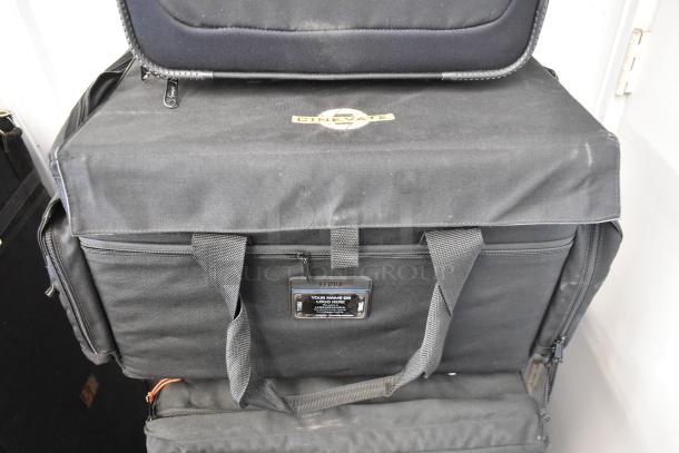 Three assorted bags including Lowepro, Tenba, Porta Brace; durable black fabric, label indicates "Cinevate" logo.