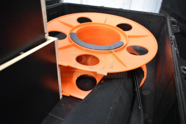Pelican Air hard case containing a Pearstone unit with an orange reel, in excellent condition, ideal for secure transport.