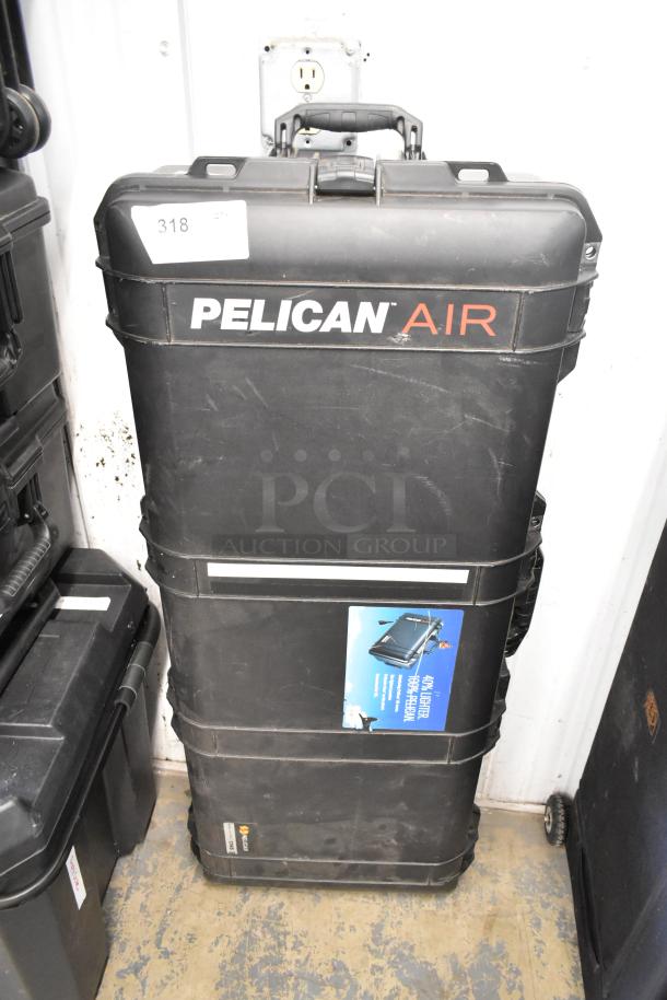 Pearstone Unit in Pelican Air hard case, black, sturdy with handle, visible "Pelican Air" logo, and label indicating lightweight design.