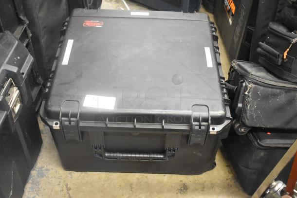 SKB Hard Case, black, in good condition, with secure latches and handle, features logo and label "320" on the lid.