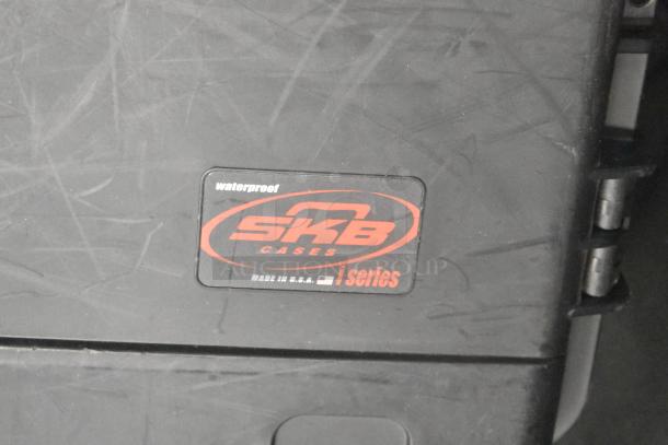 SKB Hard Case with "waterproof" label and "Made in U.S.A." marking, shows iSeries branding and visible surface scratches.