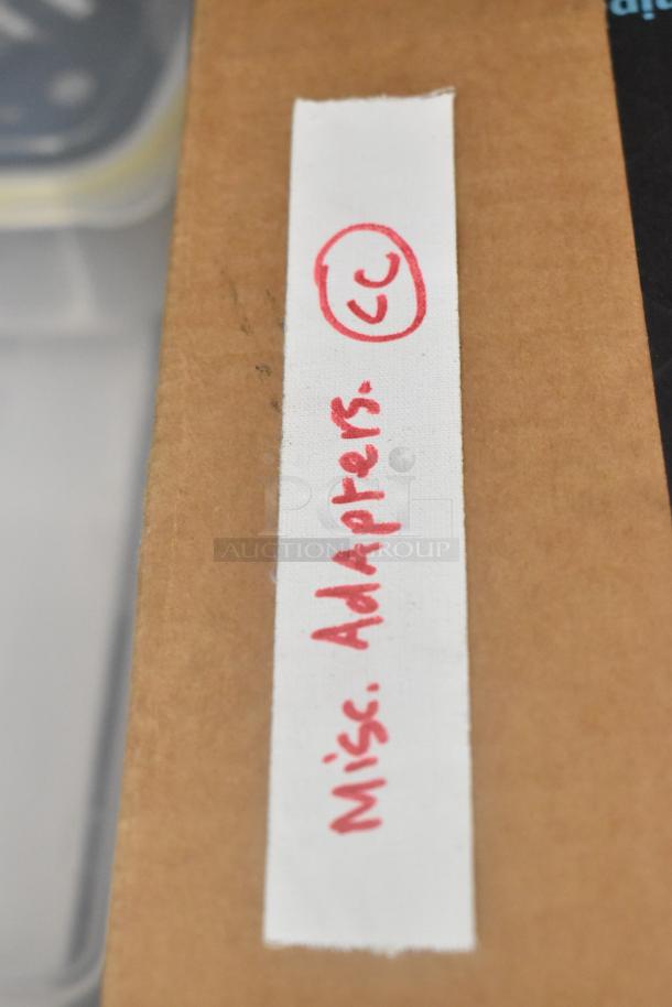 Label reads "Misc. Adapters" handwritten in red on fabric strip.