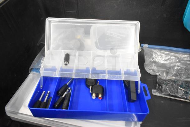 Pelican hard case with adapters, Zip Linq items, and poly containers. Clear and blue dividers shown.