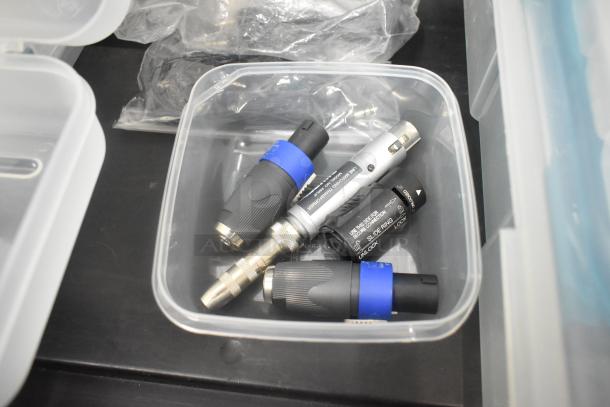 Pelican hard case contents include adapters and connectors in poly containers. Tags show "Unlock" instruction markings.
