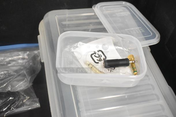 Pelican Hard Case with adapters, Zip Linq, and poly containers. Visible labels and connectors. Good condition.