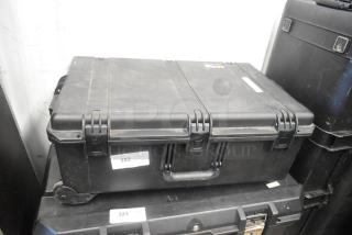 Ditogear hard case with locks, containing cables, Vipow LP7.5-12 battery, Dragon Frame, and Ditogear unit, shows slight wear.