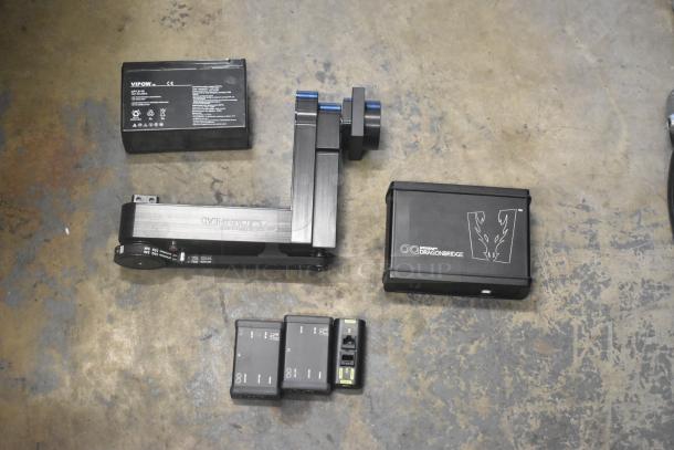Ditogear hard case contents include cables, Vipow LP7.5-12 battery, Dragon Frame, Ditogear unit. Items shown on concrete floor.