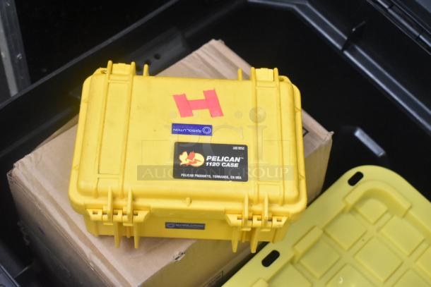 Stanley hard case containing mounting hardware, clamps, extension cords, air blowers, Ethernet cables, and a viewfinder.
