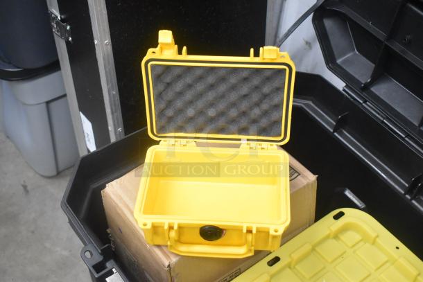 Yellow Stanley hard case with padded interior, open view. Contains mounting hardware, clamps, extension cords, blowers, cables, viewfinder.