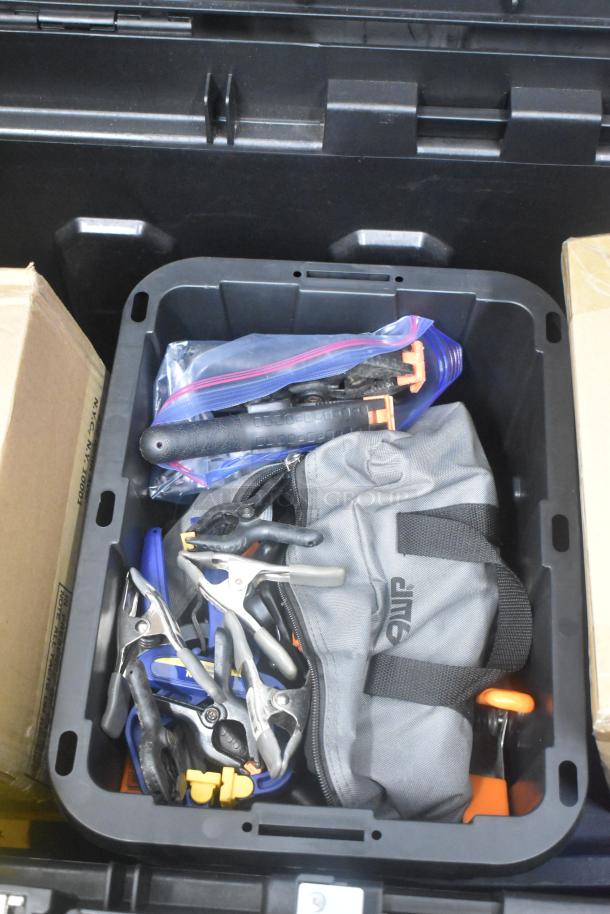 Stanley hard case with contents including clamps, extension cords, air blowers, Ethernet cables, viewfinder, and tools.