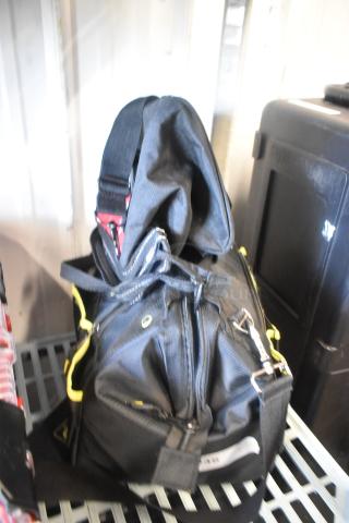 Husky and AWP bags, black with yellow accents, durable design, light wear, ideal for tool storage, features multiple pockets.