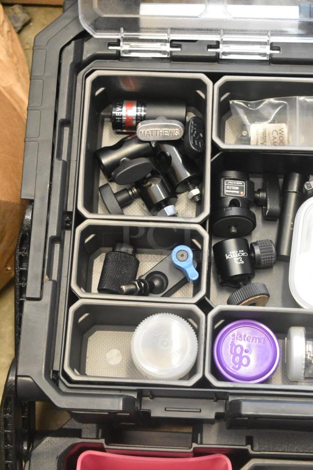 Husky poly bin containing assorted hardware and accessories, including Matthews branded items. Bin shows organized compartments and labels.