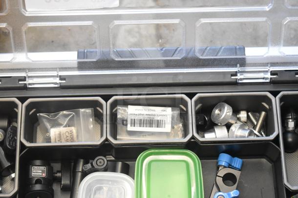 Husky poly bin containing assorted hardware, including screws and knobs. Labeled bags visible, in good condition.