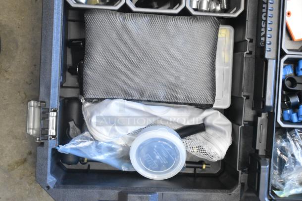 Husky poly bin containing assorted hardware items, organized in compartments. Includes bags and plastic containers.