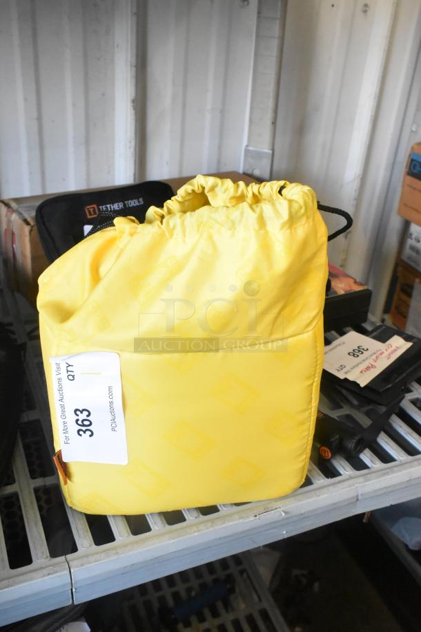 Ape Case with Anton Bauer HC Dionic battery and dual simultaneous charger, in yellow bag with tag showing lot number 363.
