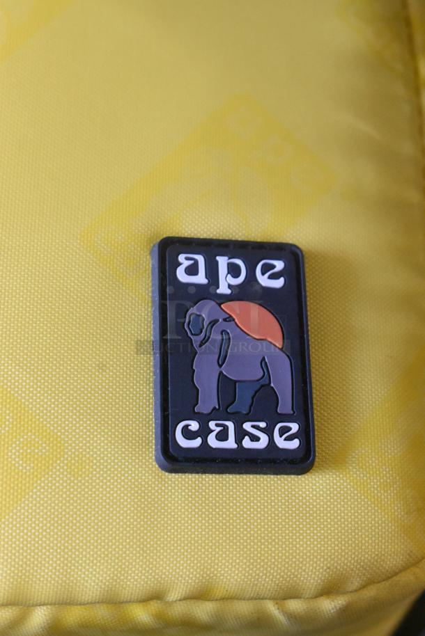 Ape Case with Anton Bauer HC Dionic Battery and Dual Simultaneous Charger, logo visible on yellow case surface.