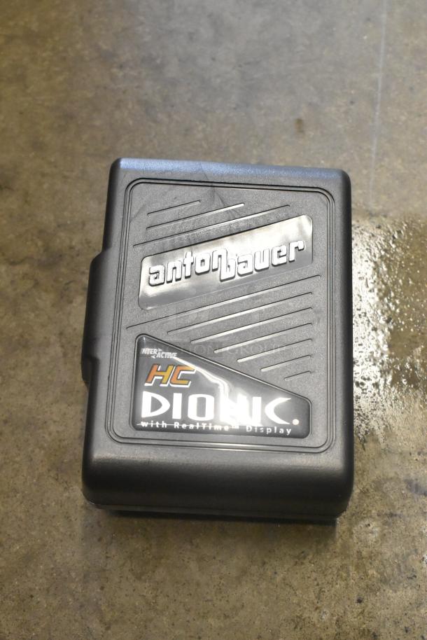 Anton Bauer HC Dionic battery in black case with branding, featuring interactive real-time display.