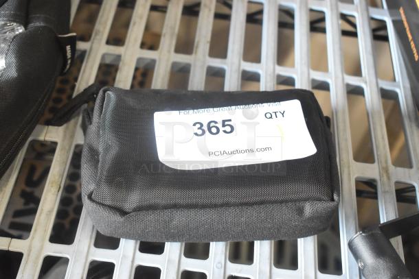 Anton Bauer Mount in black pouch on metal shelf, labeled "365" for PCI Auctions.