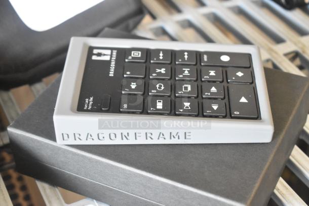 Dragon Frame Key Pad with programmable keys, brand logo visible. Excellent condition, showcased on black packaging box.