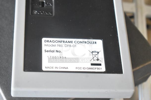 Dragon Frame Key Pad, Model DFB-01. Serial No. 17001954. FCC ID: GM8DFB01. Made in China. Black and gray exterior.