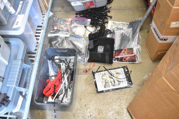 Lot of items including Porta Brace fasteners, poly bins, tie-down straps, and cables in various conditions.